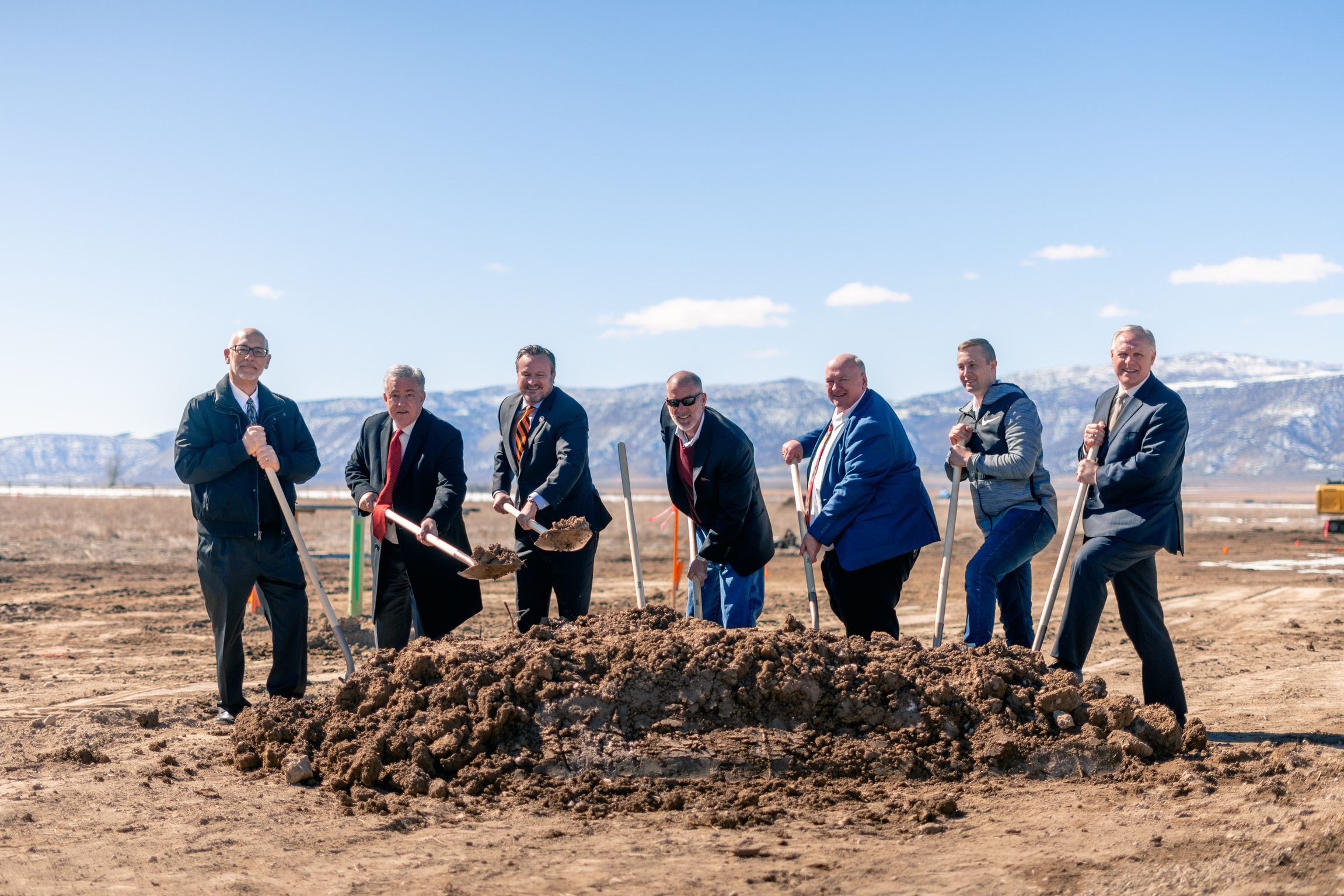 Ephraim Crossing and Ephraim city officials shovel the ceremonial first scoop of dirt at the Ephraim Crossing groundbreaking.